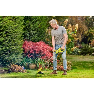 Ryobi Akku-Rasentrimmer RY18LT23A-120 im Einsatz: 18V Akku-Trimmer mit 23cm Schnittbreite für Gartenarbeit.