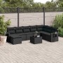 Schwarze 9-teilige Garten Sofagarnitur aus Polyrattan mit Kissen.