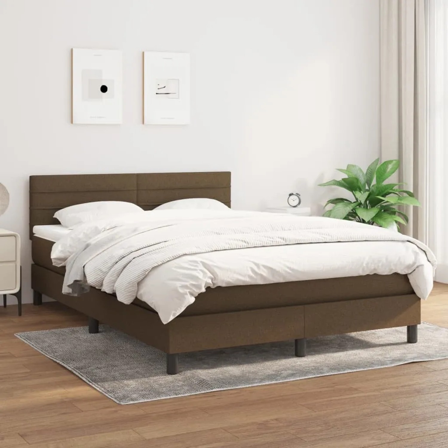 Boxspringbett dunkelbraun (140x190 cm) mit Matratze und Kopfteil.