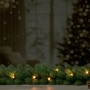 Künstliche Tannengirlande Nagano mit 30 warmweißen LEDs für festliche Deko im Innenbereich.