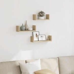 3 U-förmige Wandregale in Sonoma-Eiche aus Holzwerkstoff, dekorativ an weißer Wand über Sofa. Ideal für Stauraum.