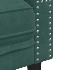Detailaufnahme: Dunkelgrünes Chesterfield Sofa mit Samtbezug und silbernen Ziernägeln.