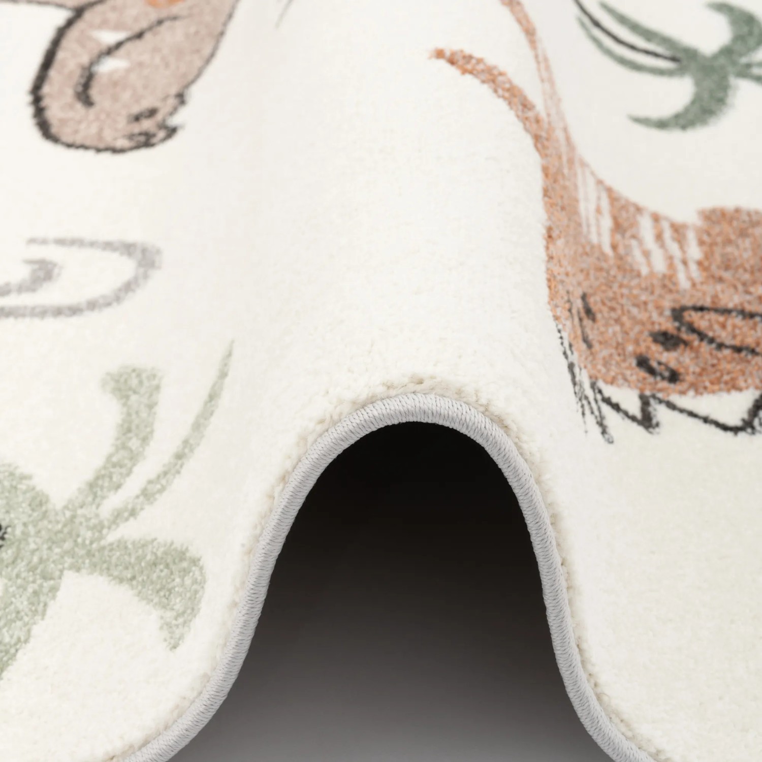 Detailansicht: Bunter Kinderteppich mit Dino-Motiven, Softstar Kids von Pergamon, 140x200cm.