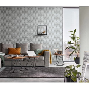 Wohnraum mit grauer Erismann Vliestapete Guido Maria Kretschmer Fashion for Walls mit Grafikmuster.