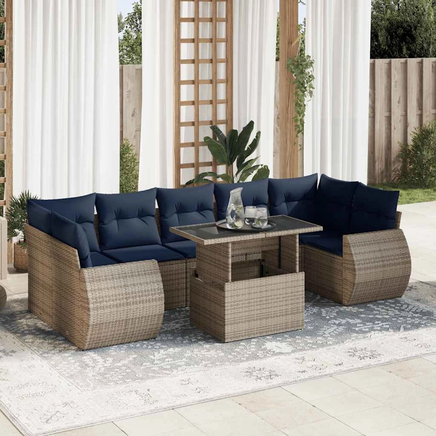 Graue vidaXL Garten-Sofagarnitur aus Rattan mit blauen Kissen und Tisch.