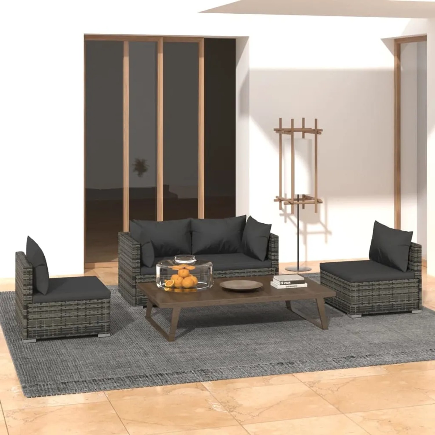 Graues 4-tlg. vidaXL Garten Lounge Set mit Kissen aus Polyrattan auf Terrasse.