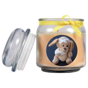 Gelbe Duftkerze im Glas mit Hunde-Motiv und Vanille-Duft. Ideal als Geschenk zur Genesung.
