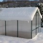 KGT Gewächshaus Orchidee Alu blank (9,59 m²) im Winter mit Schnee bedeckt.