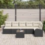Schwarzes 7-teiliges Garten-Sofa-Set aus Poly Rattan mit Kissen und Tisch.