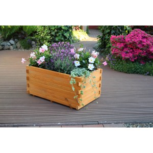 Holz Pflanzkasten Siena mit bunten Blumen und Pflanzfolie auf einer Terrasse.