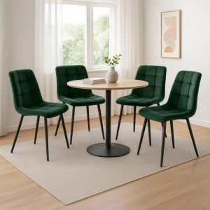 Vier grüne Samt Esszimmerstühle Asti mit schwarzen Metallbeinen um einen Holztisch in modernem Esszimmer.