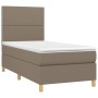 Taupes Boxspringbett 90x190 cm mit Matratze und Kopfteil.
