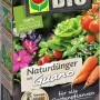 Compo Bio Naturdünger Guano 1 kg Packung mit Gemüse und Pflanzen. Gartendünger für gesundes Wachstum.