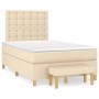 Cremefarbenes Boxspringbett 120x200 cm mit Matratze und Bank, Stoffbezug.