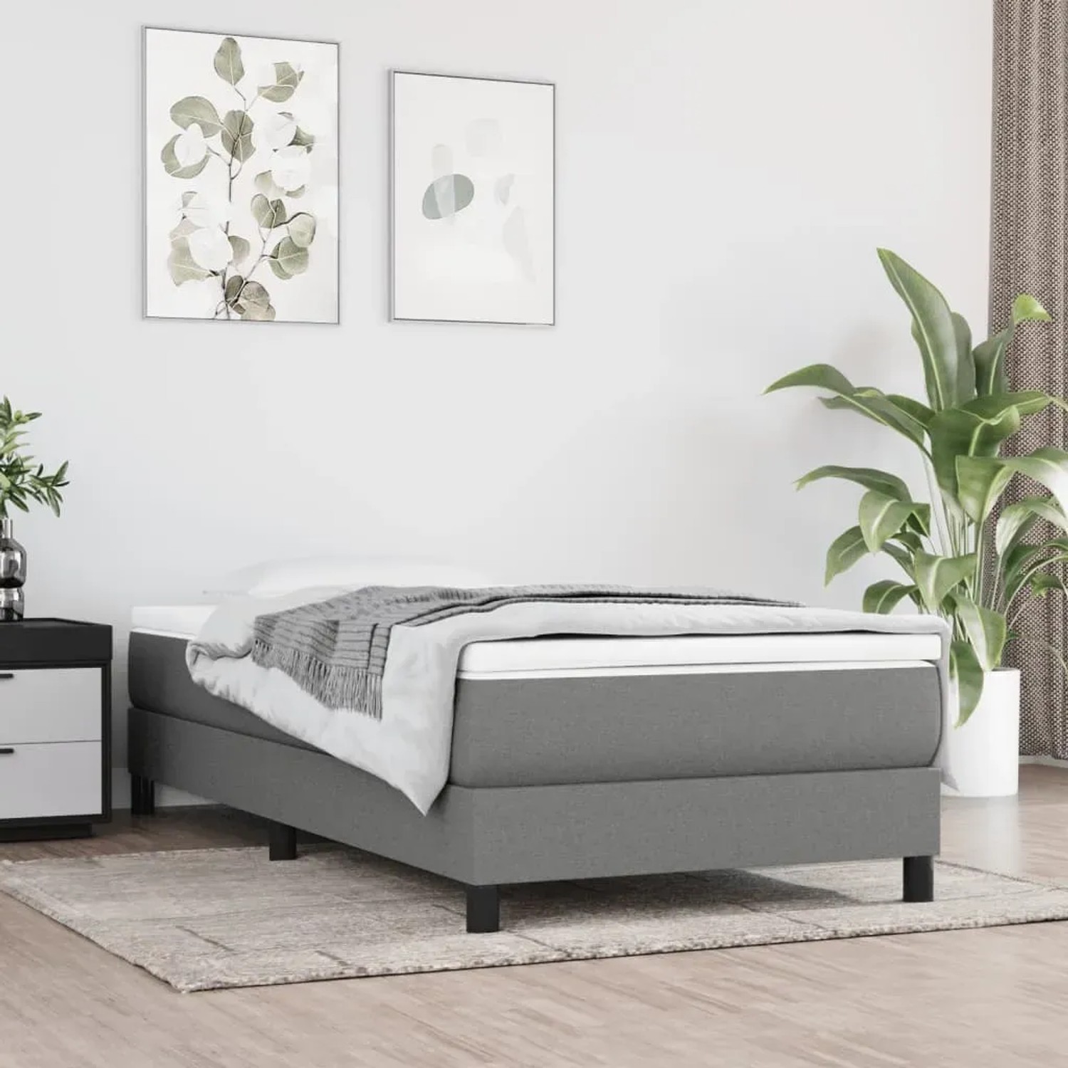 Dunkelgraues vidaXL Boxspringbett (90x200 cm) mit Stoffbezug im Schlafzimmer.