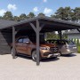 Doppelcarport Ralf mit Geräteraum in Anthrazit mit zwei parkenden Autos.
