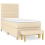 Cremefarbenes Boxspringbett (80x200 cm) mit Matratze und Bank, Stoffbezug.
