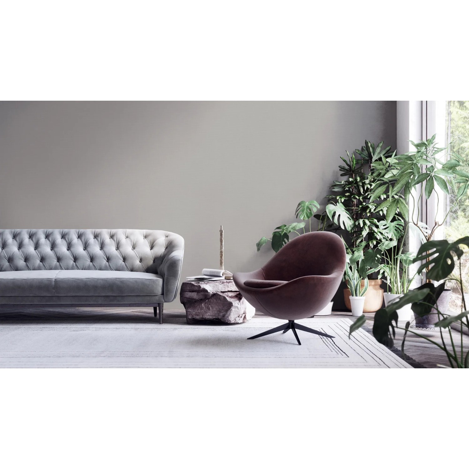 Wohnzimmer mit grauer Vliestapete, Sofa und Sessel. Dekorative Tapeten für ein gemütliches Zuhause.