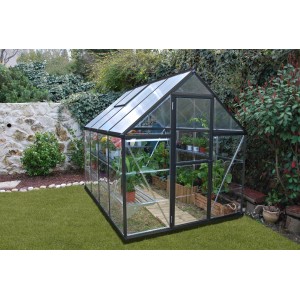 Graues Palram Canopia Gewächshaus 4,6 m² mit Fundamentrahmen im Garten.