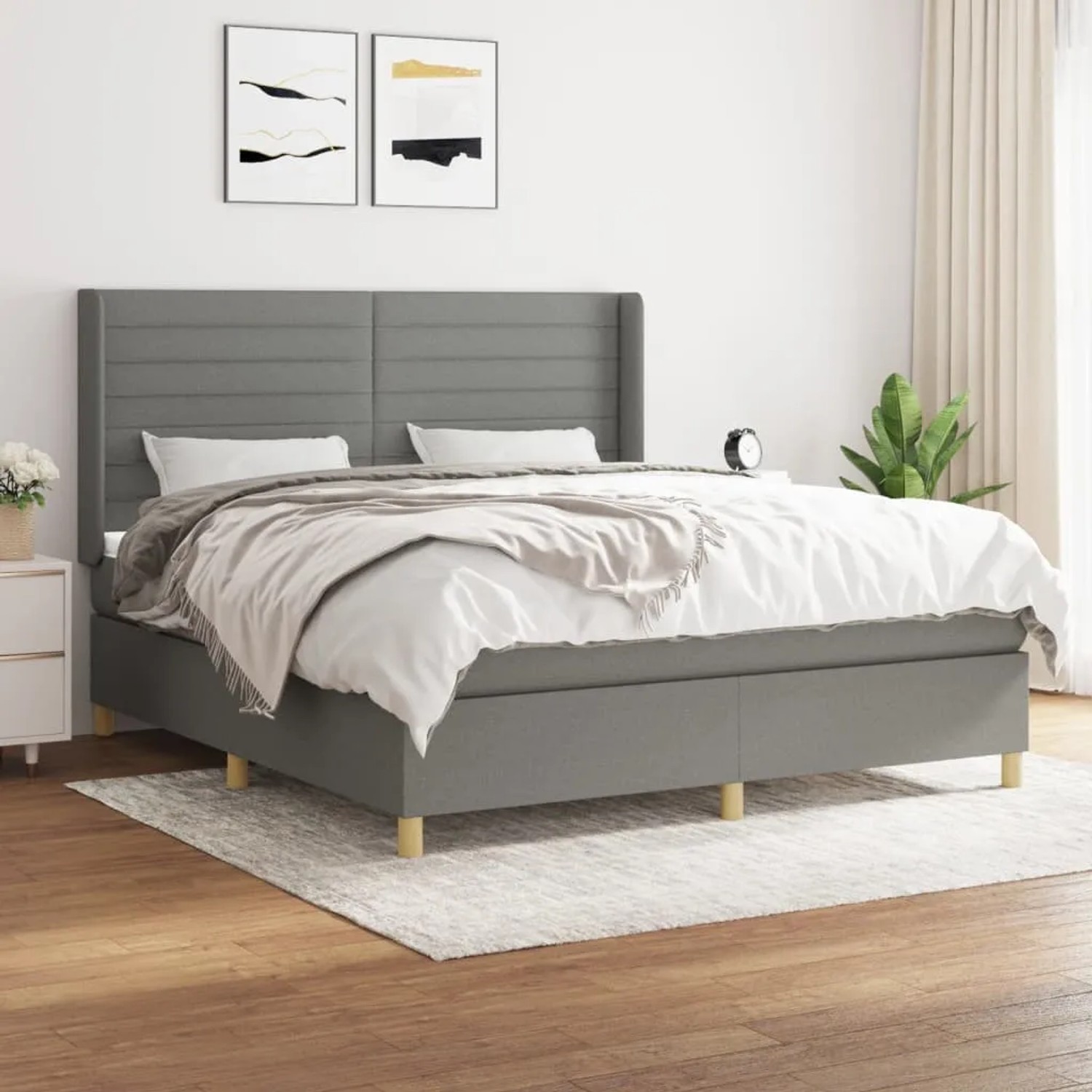 Dunkelgraues vidaXL Boxspringbett 180x200 cm mit Stoffbezug und Matratze.