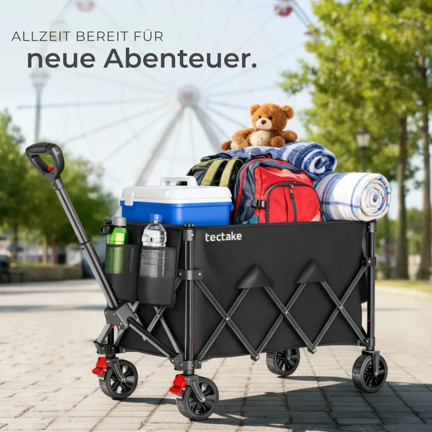 Faltbarer, schwarzer Tectake Bollerwagen Rollrider mit Gepäck und Teleskopgriff.
