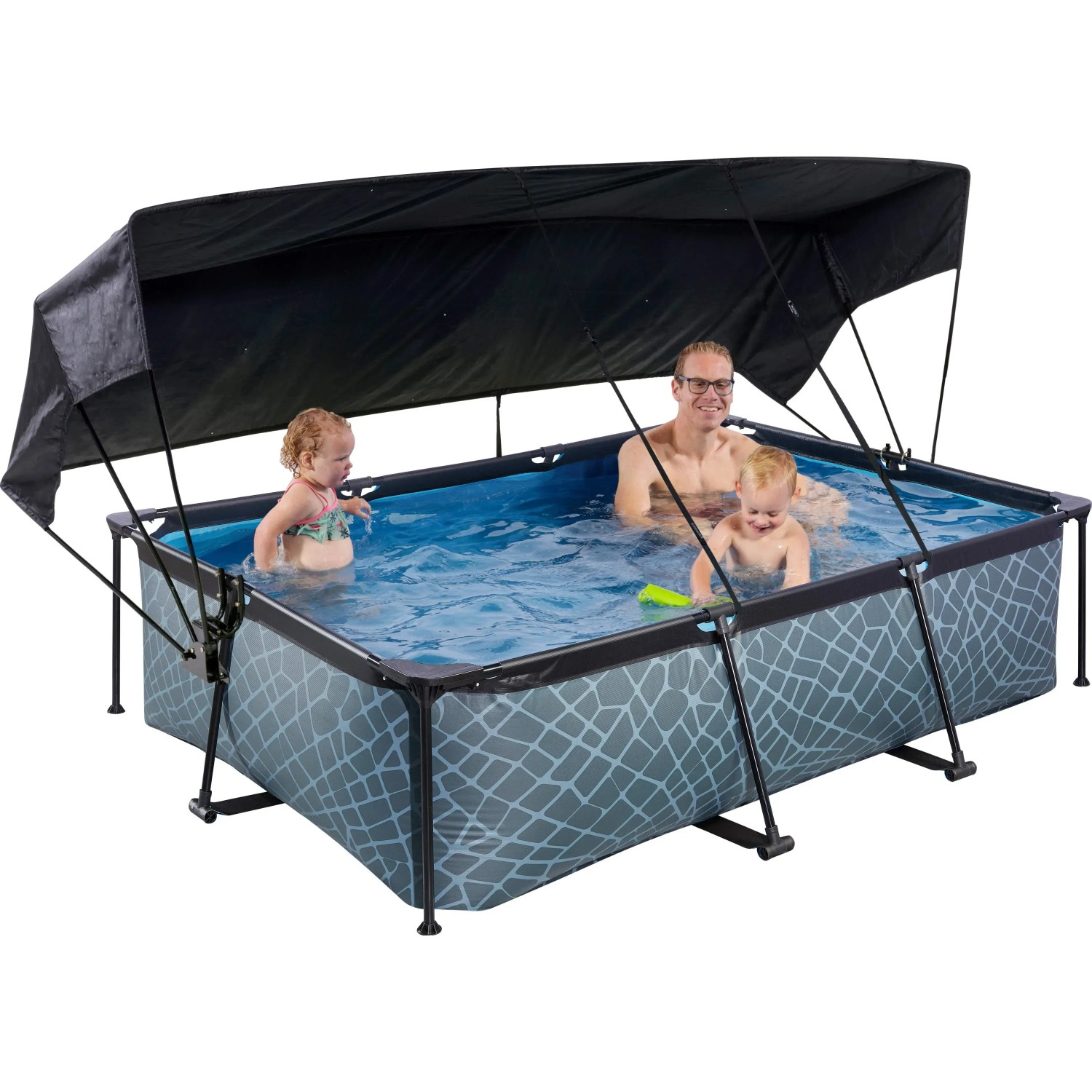Grauer EXIT Stone Pool 220x150 mit Sonnensegel und Filterpumpe, genutzt von Erwachsenem und zwei Kindern.