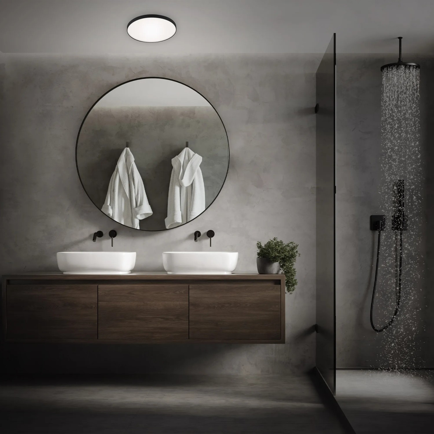 Moderne, runde Briloner Bad-Deckenleuchte Malbona in Schwarz/Weiß im Badezimmer.