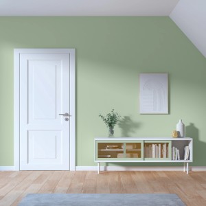 Wohnraum mit Wandfarbe Maja Jadegrün von CREATE! by OBI, mit Tür, Kommode und Deko.