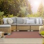 Wetterfester KARAT Outdoor Teppich Messina in Braun auf Terrasse mit Gartenmöbeln.