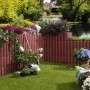 Braunfarbige Kann Pflanzsteine Gala Flair als Gartenmauer mit Bepflanzung.