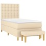 Cremefarbenes Boxspringbett (90x190 cm) mit Matratze und Bank, Stoffbezug.