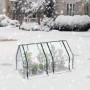 WOLTU Foliengewächshaus mit Metallrahmen und Pflanzen im Schnee.