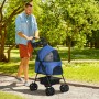 Blauer PawHut Hundewagen mit Becherhalter und klappbarem Gestell im Park.