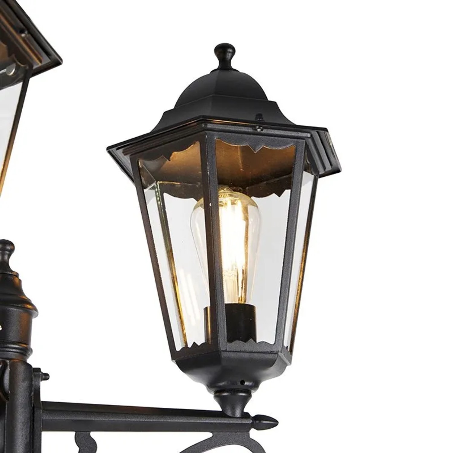 Detailaufnahme der schwarzen QAZQA Außenlaterne Havanna mit drei Lampen und klarem Glas.