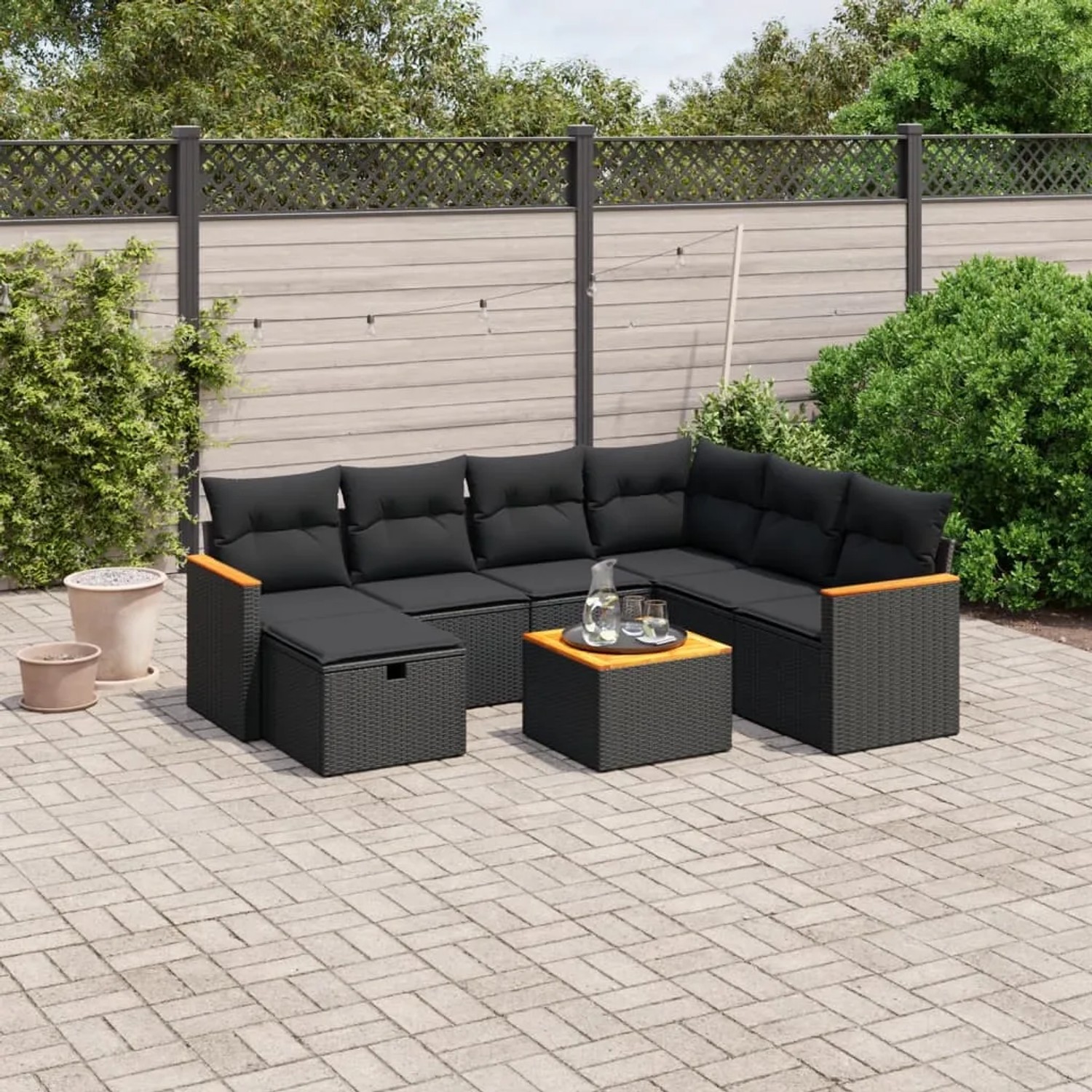Schwarze 8-tlg. vidaXL Garten-Sofagarnitur aus Poly Rattan mit Kissen und Tisch.