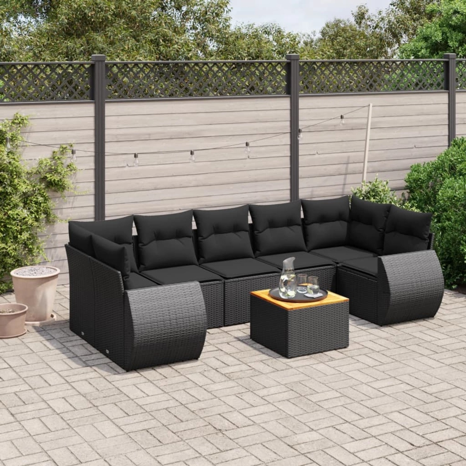 Schwarze 8-tlg. vidaXL Garten-Sofagarnitur aus Poly Rattan mit Kissen und Tisch.