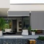 Graues Peddy Shield Sonnenrollo (100x240cm) am Haus, für Balkon & Terrasse.