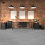 Verlegter Click-Vinylboden Fliese Graz in Betonoptik im Raum mit Backsteinwand.