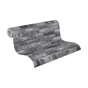 A.S. Création Vliestapete in dunklem Grau mit Ziegelstein-Optik auf einer Rolle.