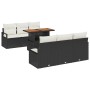 Schwarzes 7-teiliges vidaXL Garten-Sofa-Set aus Poly Rattan mit Tisch und Staufächern.