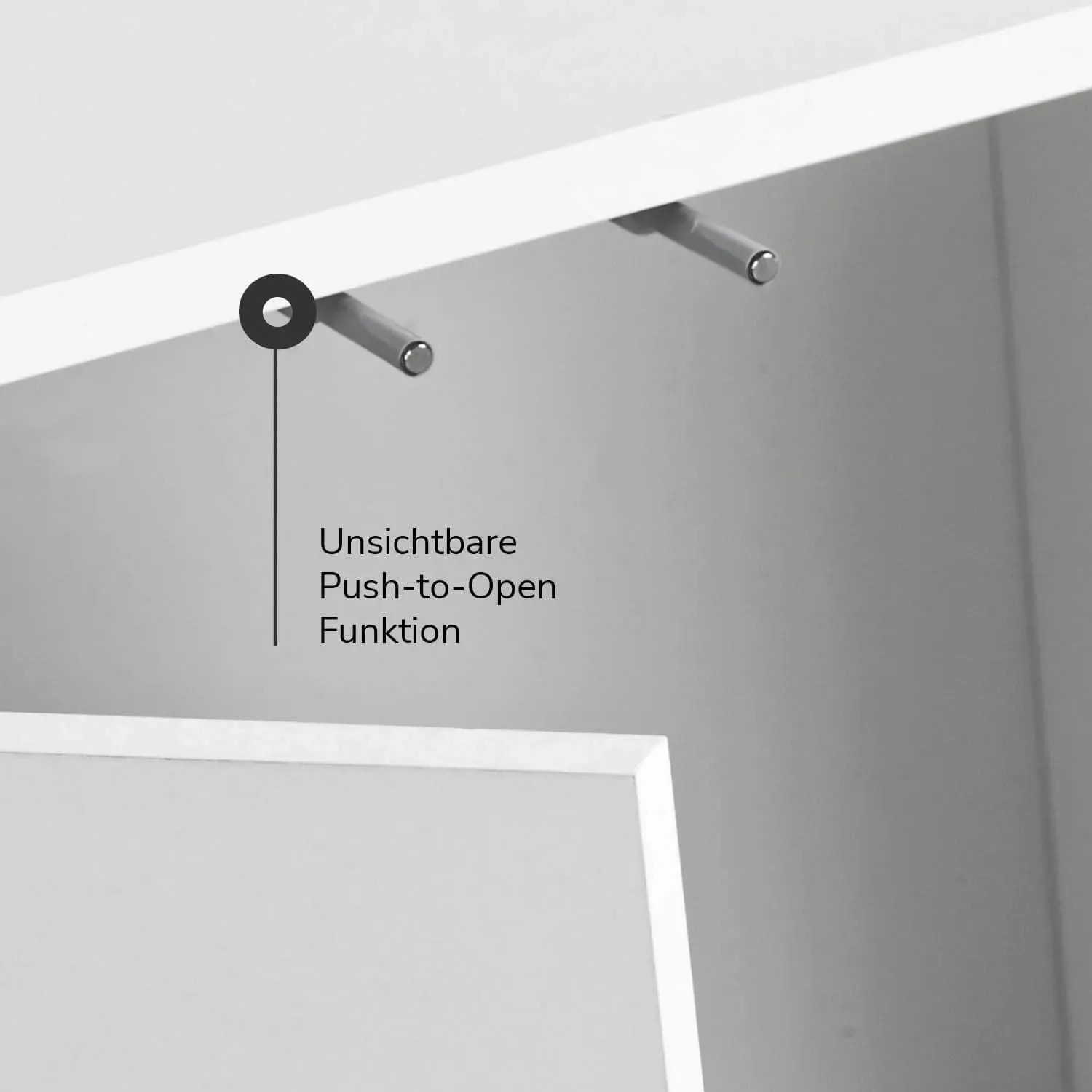 Detailaufnahme: Push-to-Open Funktion des weißen mokebo Midischranks / Büroschranks.