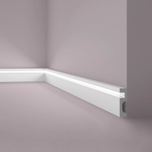 Graue NOEL & MARQUET Sockelleiste IL11 mit indirekter Beleuchtung an Wand.