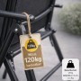 Detailaufnahme: Schwarzer Gartenstuhl, klappbar, mit Hinweisschild zur Belastbarkeit bis 120 kg.
