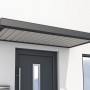 Anthrazitfarbenes Gutta Rechteckvordach NM aus Aluminium, 200x90 cm, über einer Haustür.