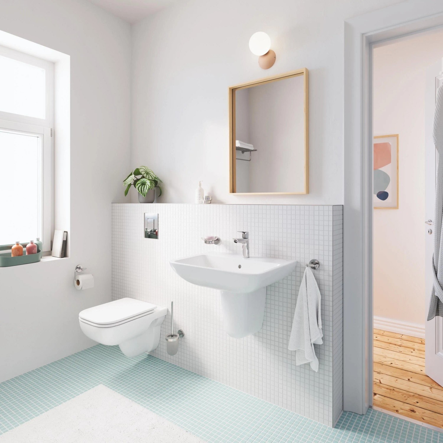 Modernes Bad mit Grohe Wand-Tiefspül-WC Start Edge und passendem Waschbecken in Alpinweiß.