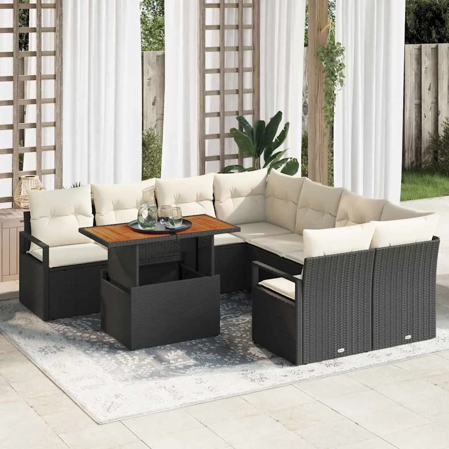 Schwarzes 9-teiliges vidaXL Garten-Sofa-Set aus Poly Rattan mit Stauraum und Tisch.
