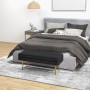 Schwarze HOMCOM Polsterbank mit Samtoptik, Stauraum und goldenen Beinen als Hocker im Schlafzimmer.