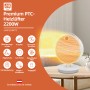 Weißer PTC-Heizlüfter (2200 W) mit Schwenkfunktion auf einem Tisch. Elektrisches Heizgerät mit Überhitzungsschutz.
