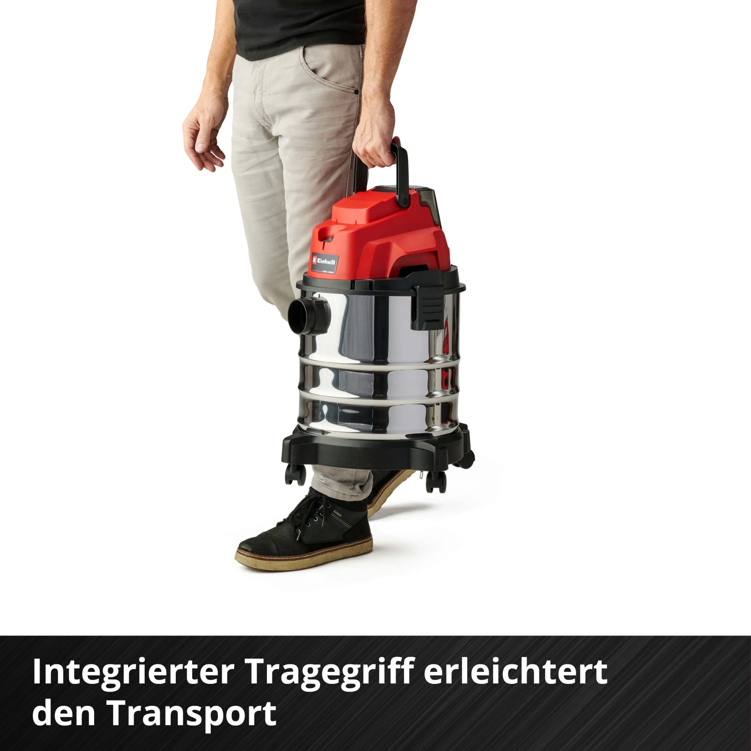 Einhell Akku-Nass-Trockensauger TC-VC 18/20 Li Solo mit Edelstahlbehälter wird getragen.