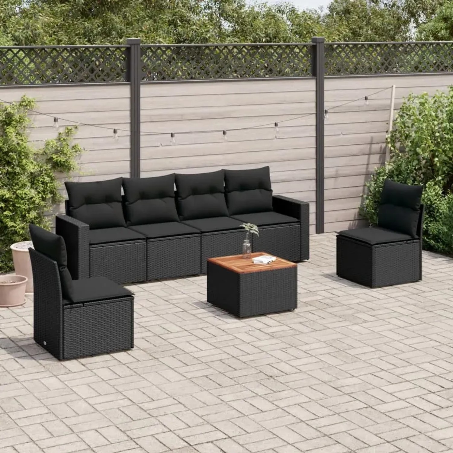 Schwarze 7-tlg. vidaXL Garten-Sofagarnitur aus Polyrattan mit Kissen und Tisch.